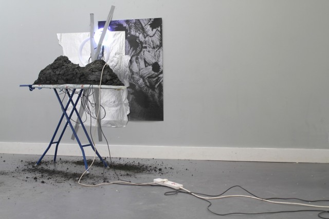 JESSICA_RAMM_coal_ash_power_station_waste,_ironing_board,_iron,_aluminium_foil,_iron_filings_print,_electrical_components_2017.jpg